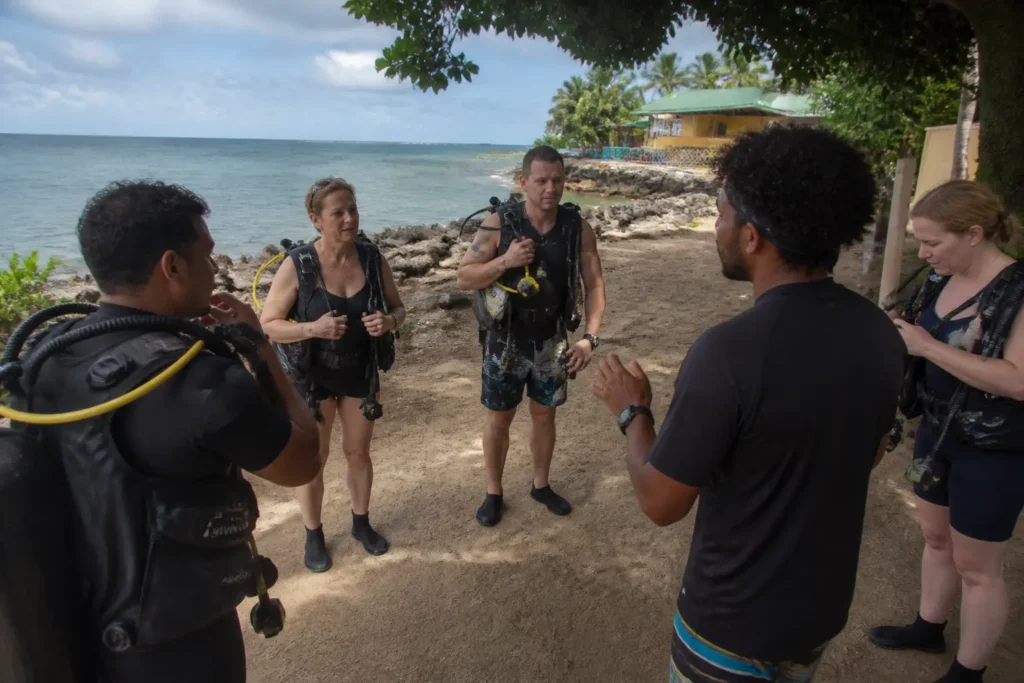 Cruise travelers preparing for a scuba diving excursion in Roatan